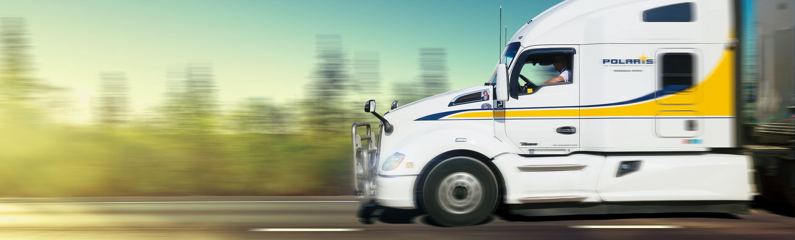 Polaris transport truck driving on highway with background blurred