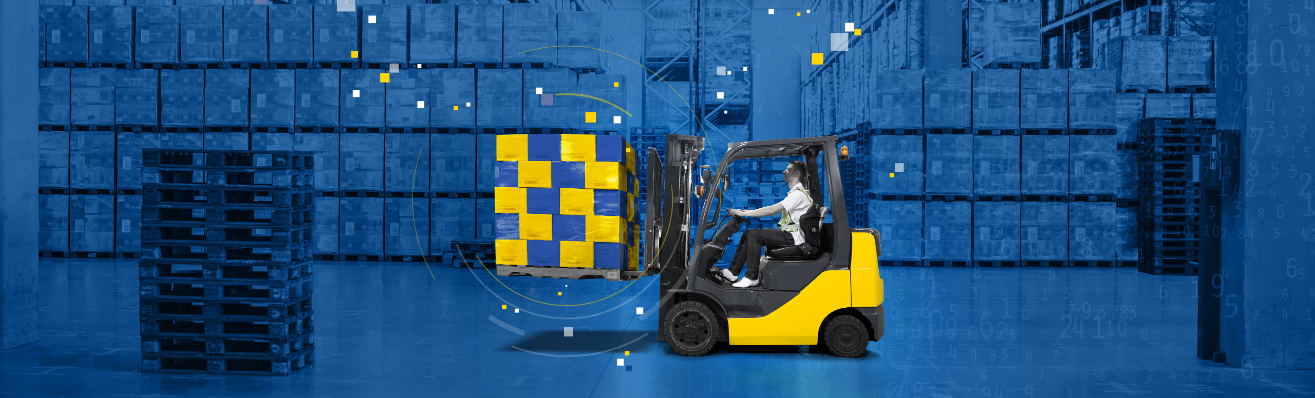 Warehouse interior with yellow forklift holding 20 blue and yellow boxes