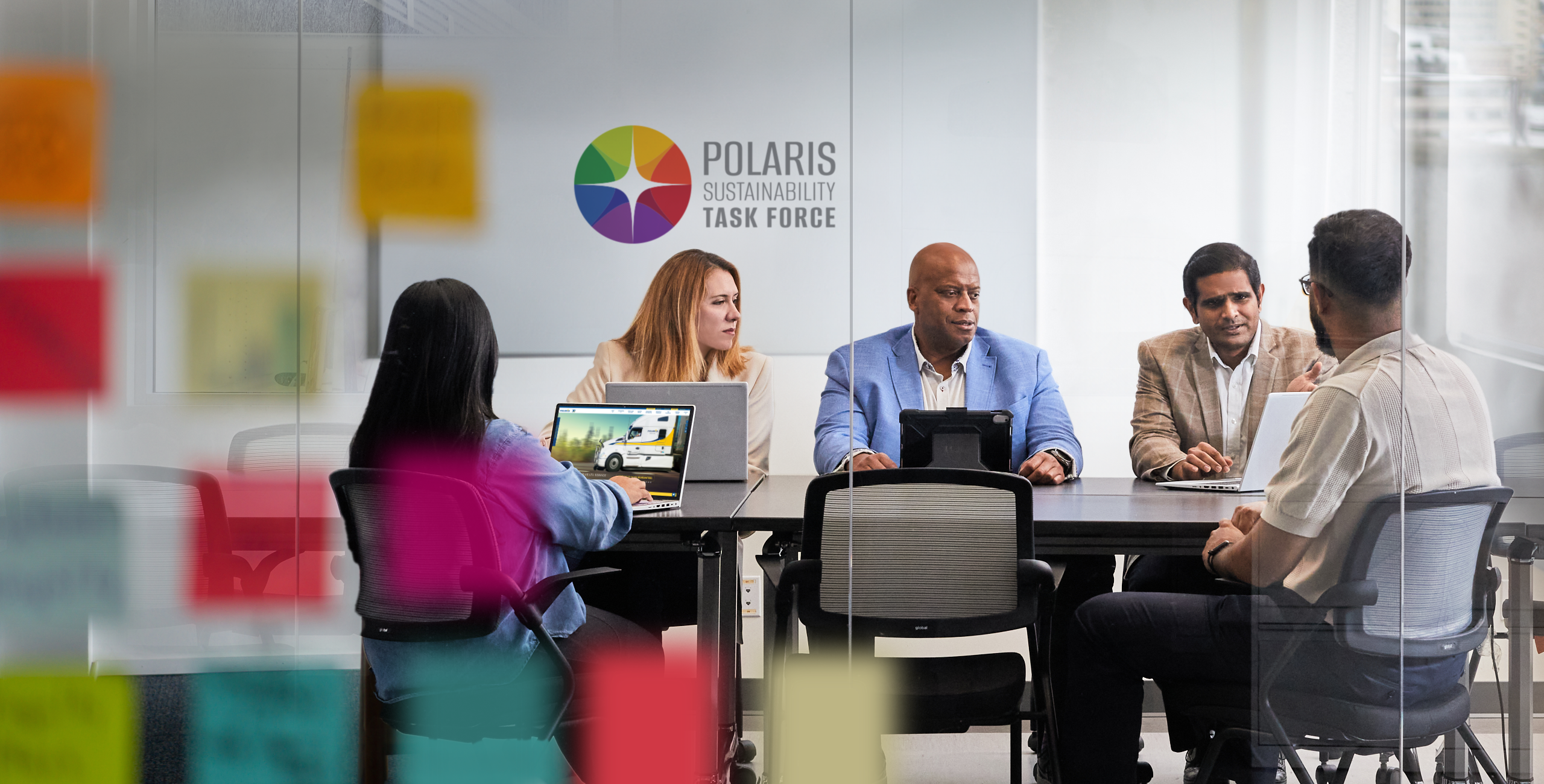 Photo of Polaris Sustainability Task Force discussing environmental policies in office